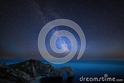 Beautiful vibrant image of Milky Way galaxy over sea landscape i Stock Photo