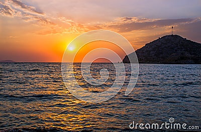 Sunset over the Turkish beach of Gumusluk Stock Photo