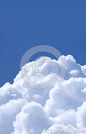 Fluffy White Cumulus Clouds on Vibrant Blue Sunny Sky Stock Photo