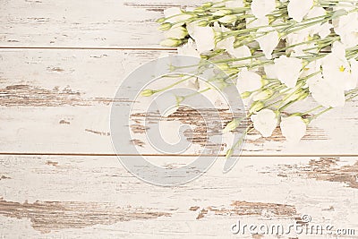 Stunning fresh bouquet of white flowers on light rustic wooden background. Copy space, floral frame. Wedding, gift card, valentine Stock Photo