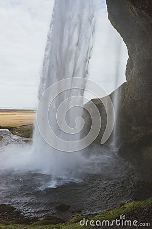 Stunning Iceland landscape photography. Beautiful waterfall Seljalandsfoss on the country side in the mountains of Iceland Stock Photo