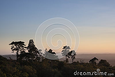 Stunning late Summer evening sunset with vibrant colours in South Downs National Park UK Stock Photo