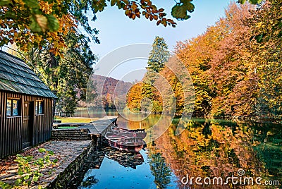 Stunning morning view of pure water lake with boats in Plitvice National Park. Amazing autumn scene of Croatia, Europe. Beauty of Stock Photo