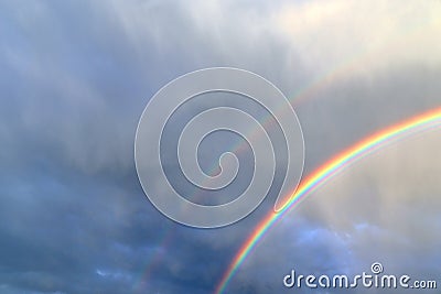 Stunning natural double rainbows plus supernumerary bows seen at a lake in northern germany Stock Photo