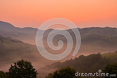 Stunning nature with misty landscape,Holbav village,Carpathians,Transylvania,Romania,Europe Stock Photo