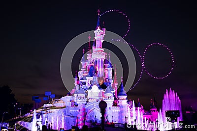 Stunning night shot of the iconic Disneyland castle lit up with vibrant colors Editorial Stock Photo