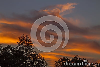 Stunning orange clouds on sunrise, France Stock Photo