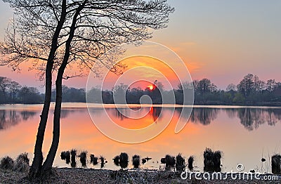 Stunning orange sunset on a landscape in northern germany Stock Photo