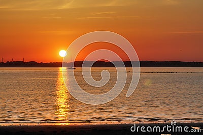 Stunning orange sunset on a landscape in northern germany Stock Photo