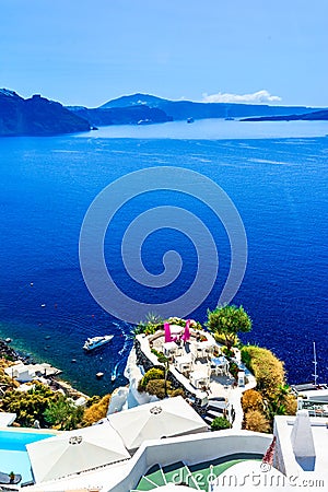 Outdoor seating at the terrace,Oia,Santorini island, Caldera, Ae Stock Photo