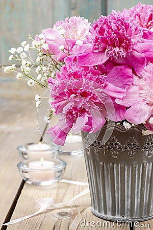 Stunning pink peonies in silver bucket Stock Photo