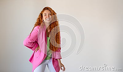 Portrait of happy ginger young woman on white background with large copy space Stock Photo