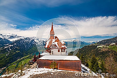 Stunning scenery with mountain hut on top Harder Kulm summit - popular tourist attraction over Interlaken, Switzerland Stock Photo