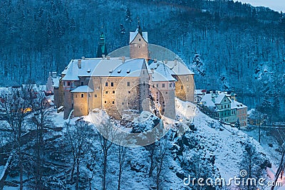 Stunning scenic view of beautiful cityscape of medieval Loket nad Ohri town with Loket Castle gothic style on massive rock. Stock Photo