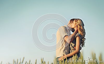 Stunning sensual young couple in love embracing at the sunset in Stock Photo