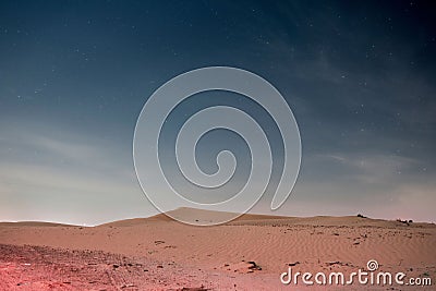 Stunning starry night sky over a sweeping desert landscape Stock Photo