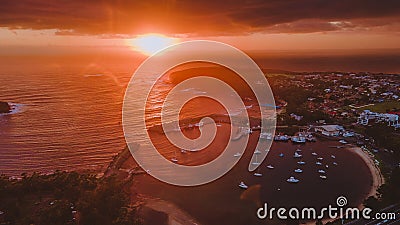 Stunning sunrise with boats at Ulladulla Harbour on the South Coast of NSW, Australia Editorial Stock Photo