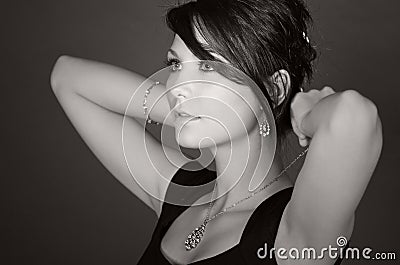 Stunning Teenage Model Putting on her Necklace Stock Photo