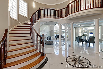 Stunning two story entry foyer with marble mosaic tiled floor Stock Photo