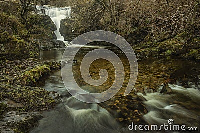 Stunning vibrant landscape image of Aira Force Upper Falls in Lake District during colorful Autumn showing Stock Photo