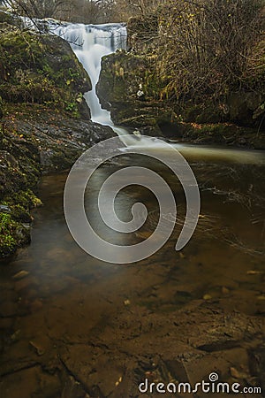 Stunning vibrant landscape image of Aira Force Upper Falls in Lake District during colorful Autumn showing Stock Photo