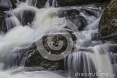 Stunning vibrant landscape image of Aira Force Upper Falls in Lake District during colorful Autumn showing Stock Photo