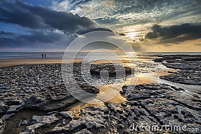 Stunning vibrant sunset landscape over Dunraven Bay in Wales Stock Photo