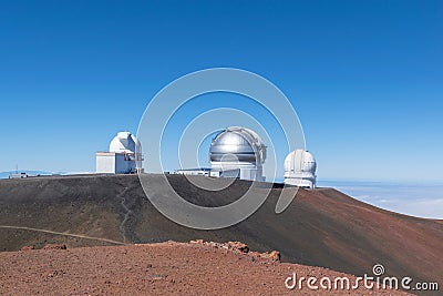 Stunning view astronomical observatories seen from the summit of Mauna Kea, a dormant volcano 4205 m on the Big Island of Hawaii Stock Photo