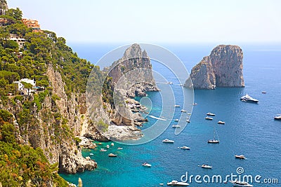 Stunning view of Capri island in a beautiful summer day with Faraglioni rocks Capri, Italy Stock Photo