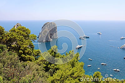Stunning view of Capri island in a beautiful summer day with Faraglioni rocks Capri, Italy Stock Photo