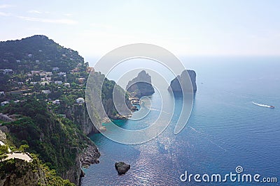 Stunning view of Capri island in a beautiful summer day with Faraglioni rocks Capri, Italy Stock Photo