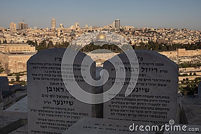 Stunning view of the city of Jerusalem, with two headstones atop a hill Editorial Stock Photo