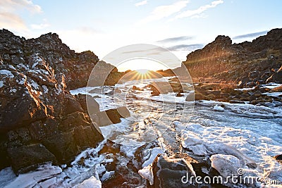 Stunning view of Ã–xarÃ¡rfoss Waterfall at Thingvellir National Park during sunset. These waterfalls are situated between two Stock Photo