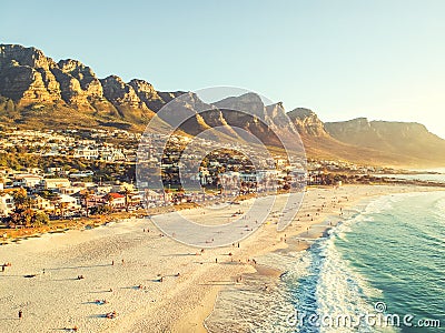 Stunning wide angle aerial drone evening view of Camps Bay, an affluent suburb of Cape Town Stock Photo