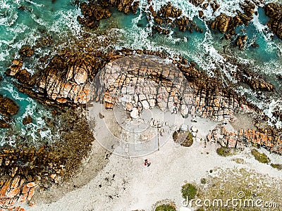 Stunning wide angle aerial drone view of rocks and breaking waves at Cape Agulhas Stock Photo