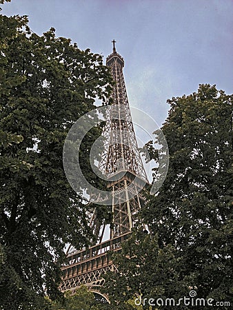 Stunning wide shot of the Eiffel Tower in detail with dramatic sky. Stock Photo