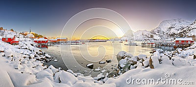 Stunning winter scenery of Moskenes village with ferryport and famous Moskenes parish Churc Stock Photo