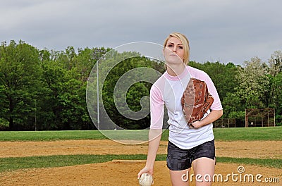 Stunning young blonde female softball player Stock Photo