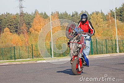 Stunt rider making wheelie Stock Photo