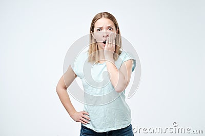 Stupefied stunned woman keeps mouth widely opened, looks in terror at camera, Stock Photo