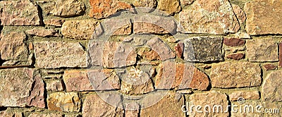 Sturdy beige and purple cut stone wall, seamless lined up Stock Photo