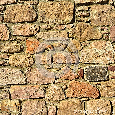 Sturdy beige and purple cut stone wall, seamless lined up Stock Photo