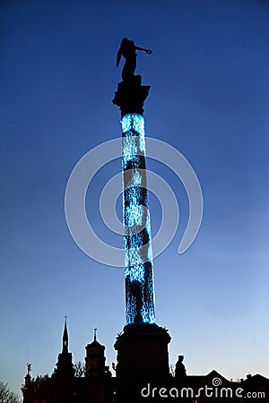 Column, statue of the Roman goddess Concordia. The Christmas market in Stuttgart, Germany. Editorial Stock Photo