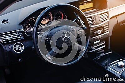 Stuttgart, Germany - January 23, 2020: Original Mercedes E-class W212 interior, avantgarde, Mercedes logo, dash board. Editorial Stock Photo