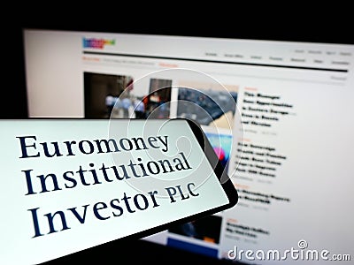 Smartphone with logo of company Euromoney Institutional Investor plc on screen in front of website. Editorial Stock Photo