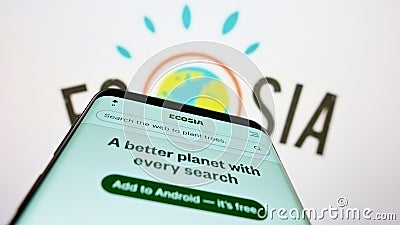 Smartphone with website of German search engine company Ecosia GmbH on screen in front of business logo. Editorial Stock Photo