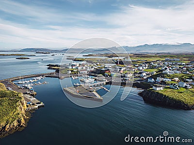 Stykkisholmskirkja Harbor with Fishing ships at Stykkisholmur town, typical Icelandic fishing harbour Stock Photo