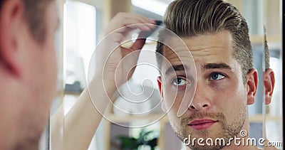 A Young Man is Combing His Hair. Stock Footage - Video of bathing, mirror:  95593040