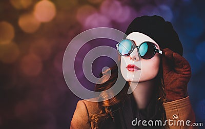 Style redhead woman in sunglasses and coat Stock Photo