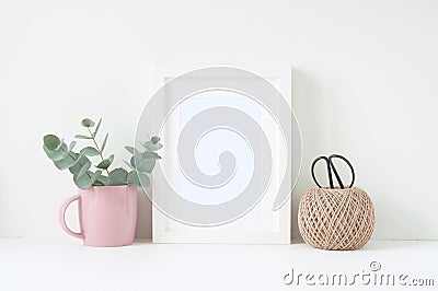 Styled composition with white frame and pink ranunculos Stock Photo